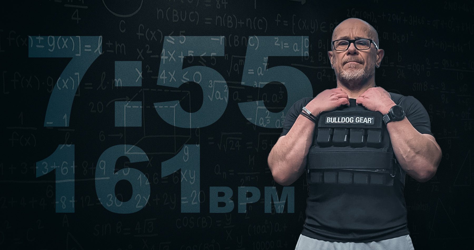 Feature image Chris James wearing a Bulldog Gear weighted vest, standing strong against a dark chalkboard of mathematical data and equations, symbolising peak performance and endurance at age 57 - 161 BPM at a 7:55 pace.
